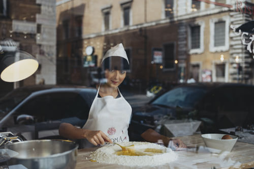 Aurora making pasta in Rome
