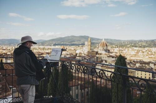Gary the artist on a balcony overlooking Florence, Italy