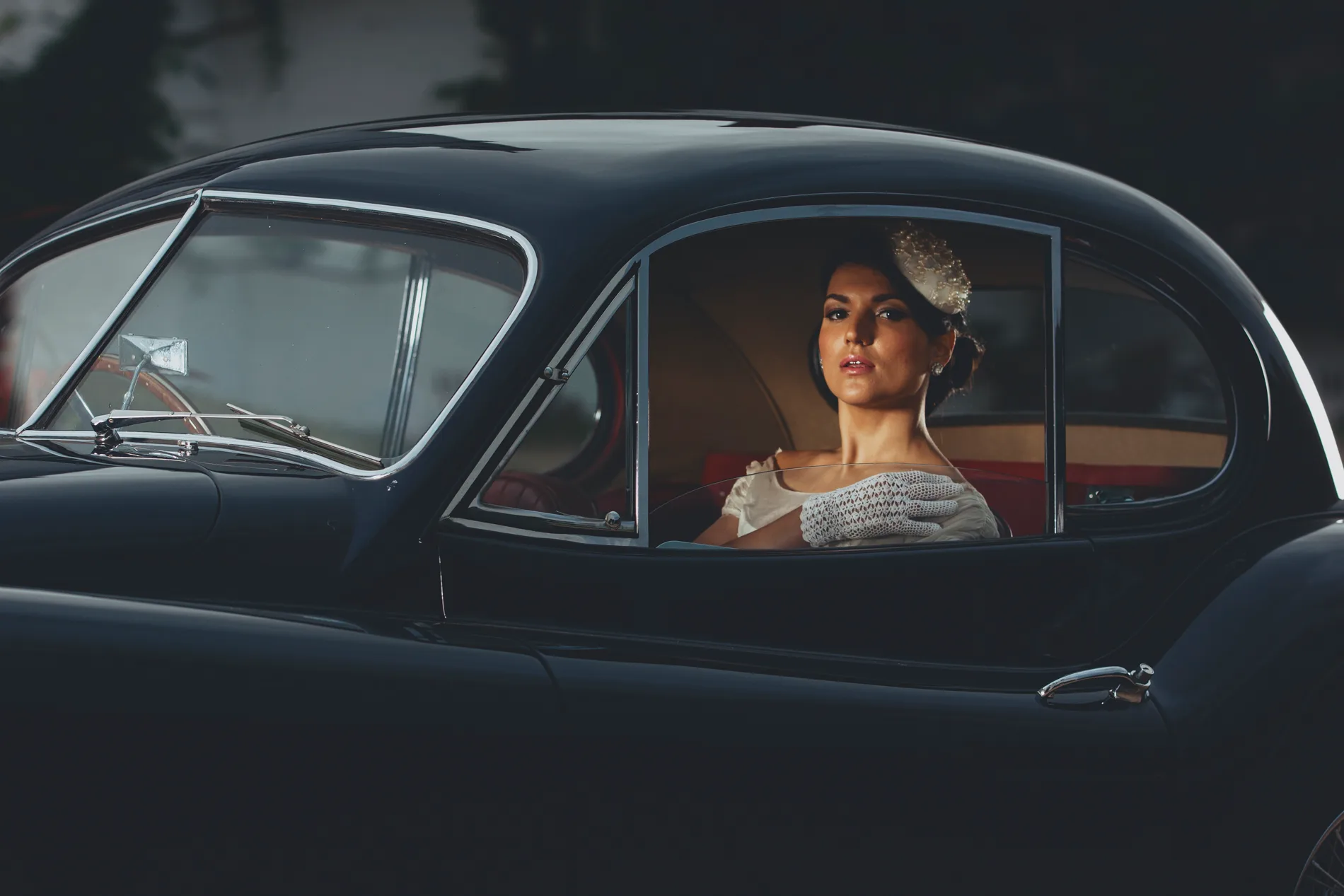 Danesfield House, Marlow. Classic Jaguar and Classic wedding dress